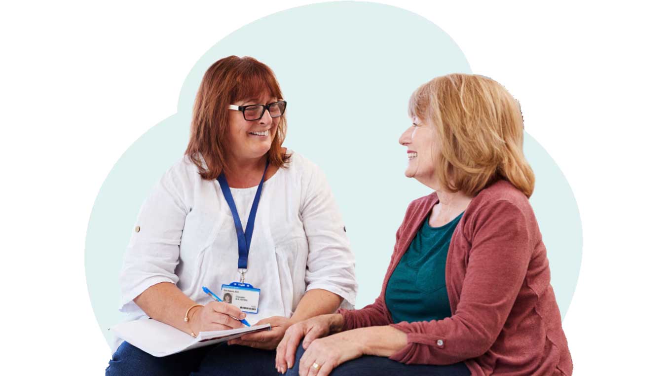 A nurse speaking with a patient